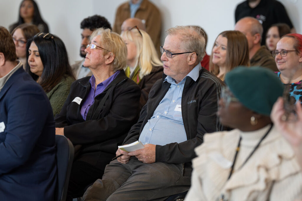 Attendees seated in the audience at a West Midlands Cyber Hub event
