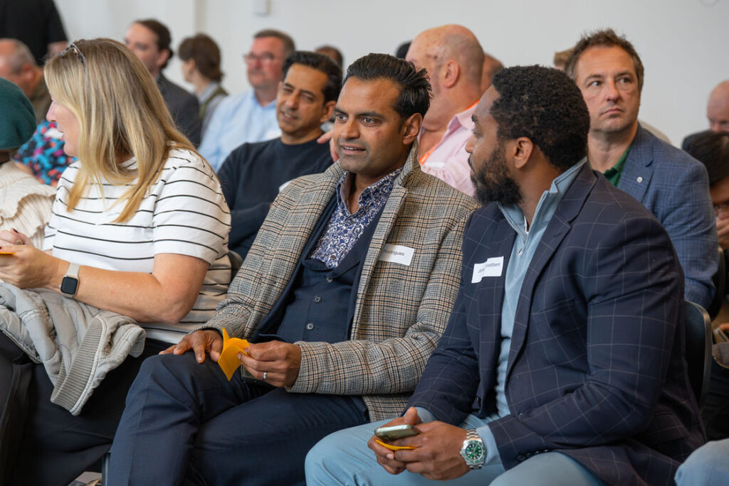 Attendees listening during a session at the Hub