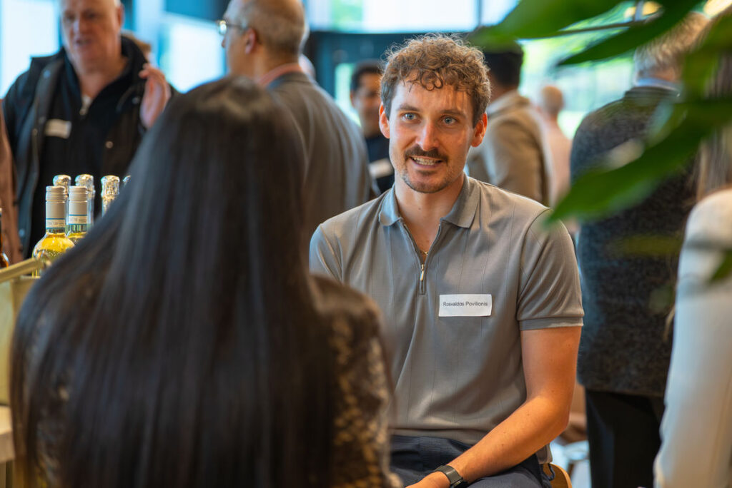 Two attendees in conversation at a Hub event