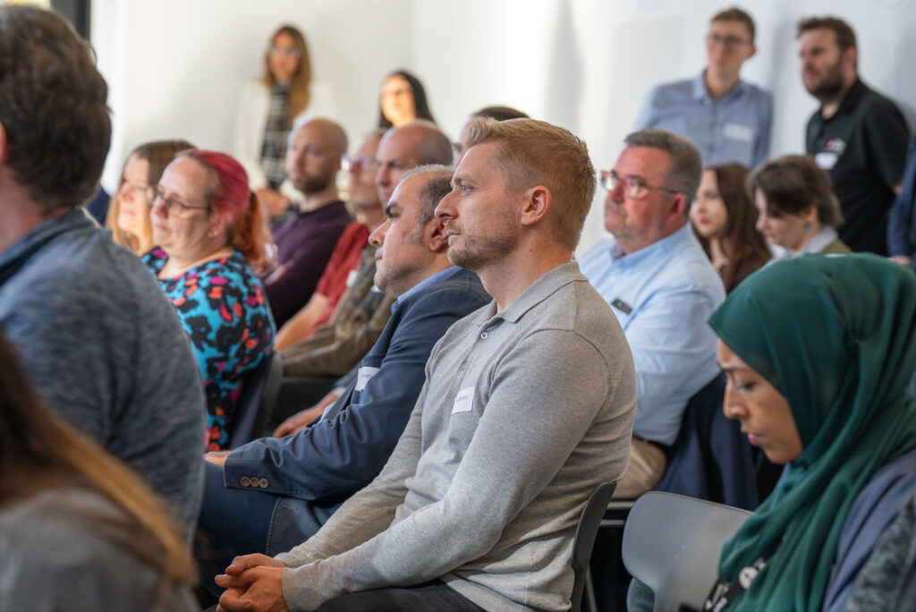 A seated audience at a West Midlands Cyber Hub session