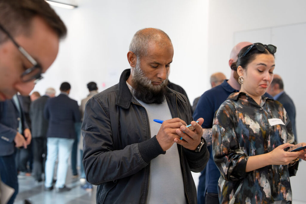 Attendees in conversation during a Hub networking session