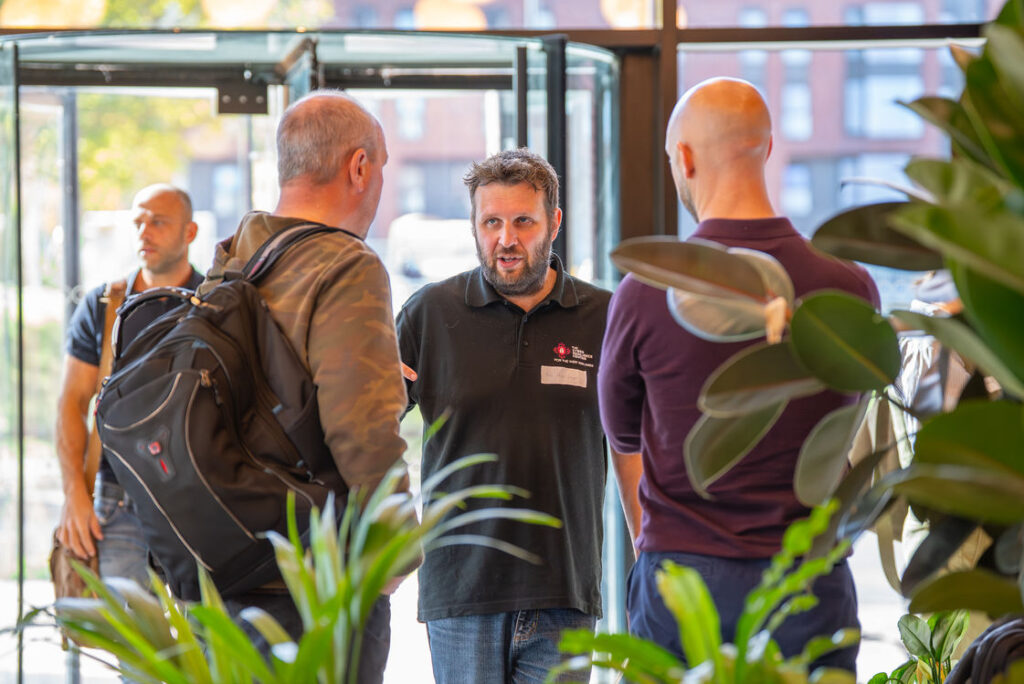 Attendees gathered near the entrance to the Hub