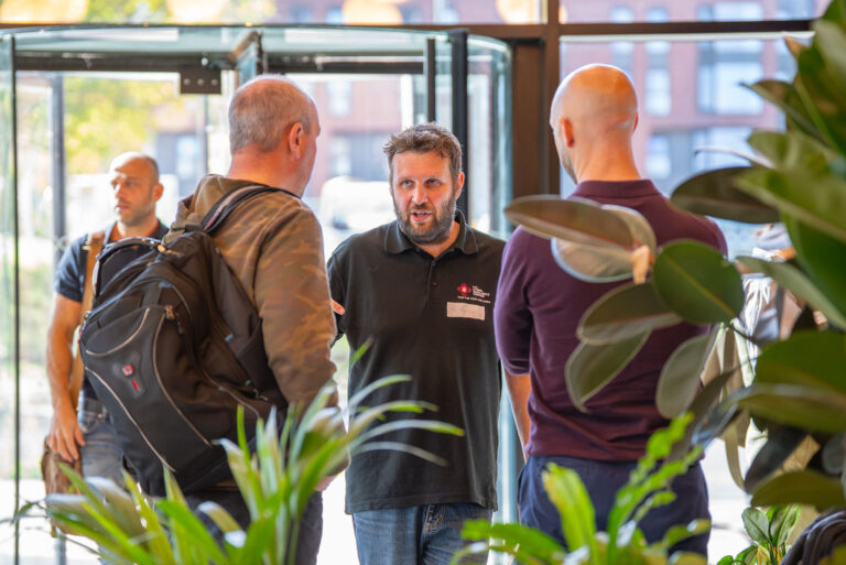 Attendees gathered near the entrance to the Hub